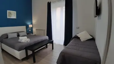 a bedroom with two beds and a window at Le Due Sicilie B&B in Lascari