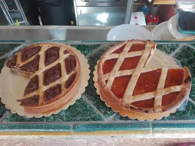 two cakes sitting on top of a glass table at B&B Donna Sabella in Santa Flavia