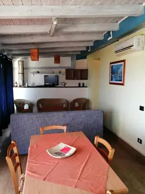 a dining room with a table and chairs at B&B Donna Sabella in Santa Flavia