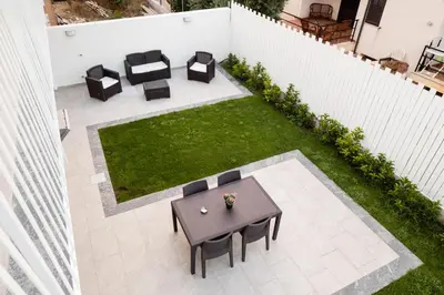 an overhead view of a patio with a table and chairs at Arricàmpati Apartments Villa & Bringo Car Rental in Carini