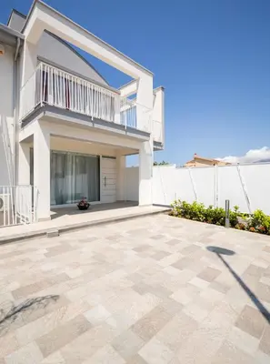 a large patio in front of a house at Arricàmpati Apartments Villa & Bringo Car Rental in Carini