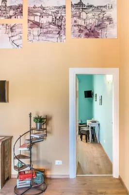a staircase in a room with drawings on the wall at SheralKes Bed&Breakfast in Palermo