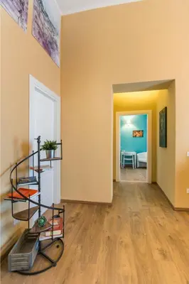a room with yellow walls and a stairwell at SheralKes Bed&Breakfast in Palermo