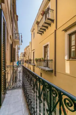 a balcony in a city with buildings and balconies at SheralKes Bed&Breakfast in Palermo