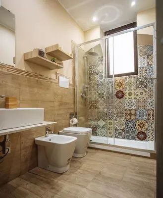 a bathroom with a shower and a toilet and a sink at Il Tempo Ritrovato - Locazione ad uso turistico in Palermo