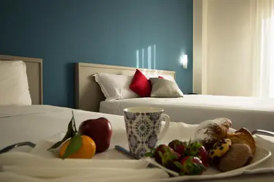 a tray of fruit on a table in a hotel room at Saracen Sands Hotel & Congress Centre - Palermo in Isola delle Femmine