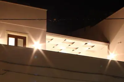 a building with lights on the side of it at La Nicchia Smart in San Vito lo Capo