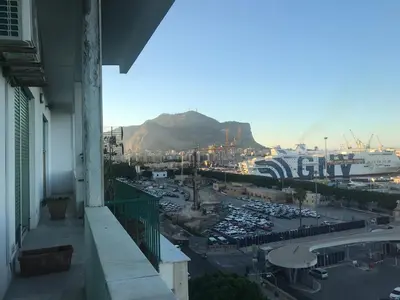 a view of a parking lot with a cruise ship at B&B Questa casa non e'un albergo in Palermo