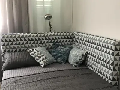 a couch with a bunch of pillows on it at B&B Questa casa non e'un albergo in Palermo