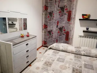 a bedroom with a dresser and a mirror at Casa nel Vicolo in Palermo