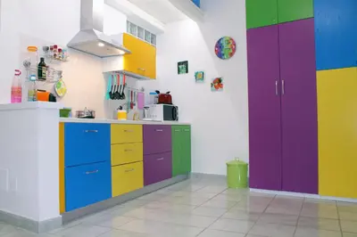a kitchen with colorful cabinets and a sink at Arco del Sole in Palermo