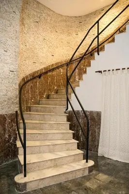 a staircase in a room with a brick wall at B&B Santa Caterina in Palermo