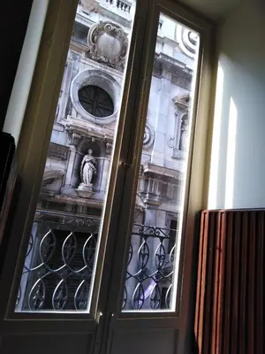 a door with glass panels in a building at B&B Santa Caterina in Palermo