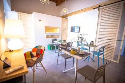 a dining room with tables and chairs and a large window at B&B Da Peppa in Castellammare del Golfo