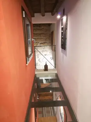 a staircase leading up to a room with a window at Il Drago e la Fenice in Palermo