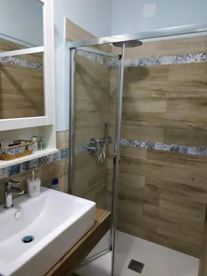 a bathroom with a sink and a shower at Alla Casetta in Palermo