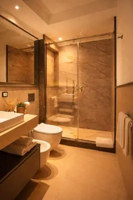 a bathroom with a shower and a toilet and a sink at Maxim in Palermo