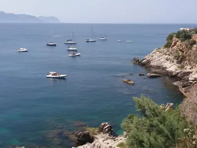 a group of boats in a large body of water at Pandora in Porticello