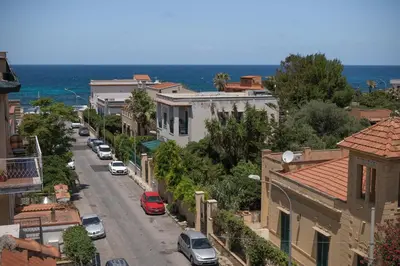 a view of a city street with cars parked at MarieRose House Sferracavallo in Sferracavallo