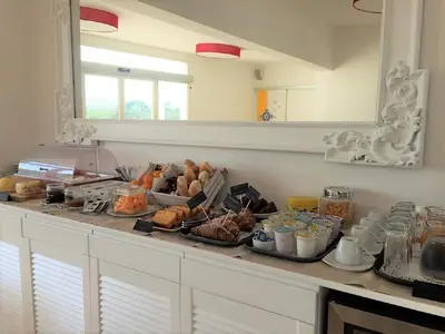 a kitchen counter with a bunch of food on it at Petruso Resort e SPA in Balestrate