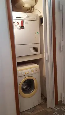 a washer and dryer in a small room at Casa Baarìa in Bagheria