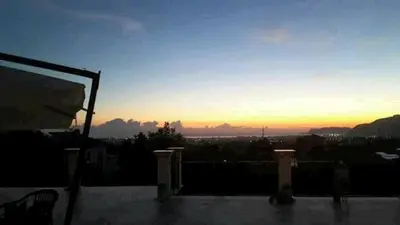 a view of the sunset from a balcony of a building at Rocca Di Monreale in Monreale