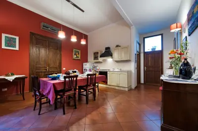 a kitchen and dining room with a table and chairs at B&B Casa Degli Artisti in Palermo