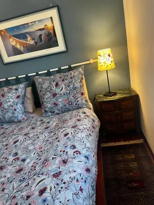 a bedroom with a bed and a lamp on a night stand at Incantevole E A Due Passi Dal Centro in Palermo