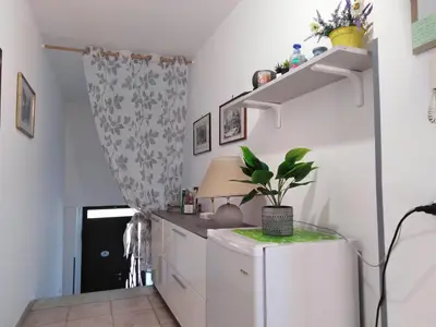 a kitchen with a small white refrigerator in a room at Porta Nuove Vacanze in Palermo