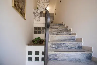 a stairwell with blue and white marble at Porta Nuove Vacanze in Palermo