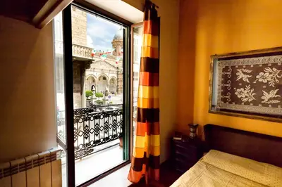 a room with a window with a view of a balcony at Vista Cattedrale in Palermo
