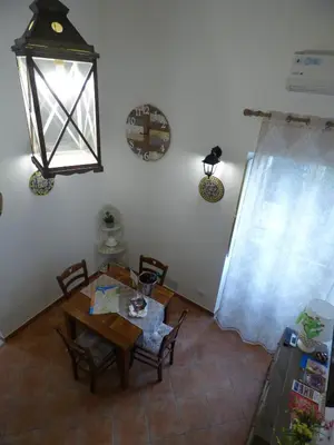 a dining room with a table and chairs at Casa Sicana in Palermo