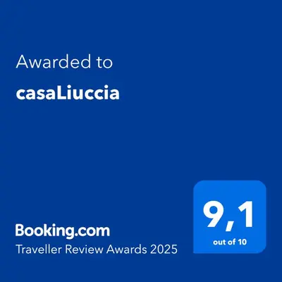 a blue text box with the words awarded to caselica at casaLiuccia in Mondello