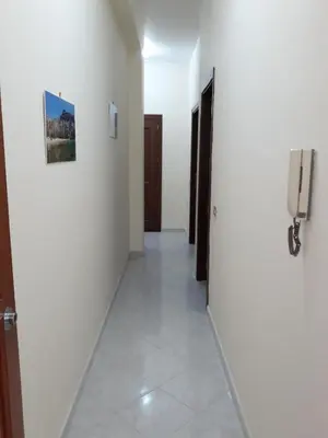 a hallway with a phone in a white room at casaLiuccia in Mondello