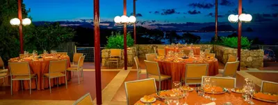 a table set up for a meal on a patio at Hotel Torre Normanna in Altavilla Milicia