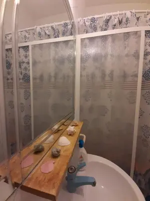 a bathroom with a shower and a toilet with a sink at Casa Marisa in Palermo