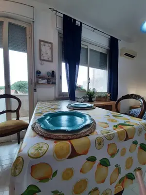 a table with a blue plate on top of it at Casa Marisa in Palermo