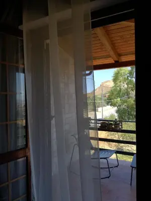 a sliding glass door with a view of a patio at Simo Amour in Lercara Friddi