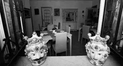 two vases sitting on top of a table at Cannatella's Mansion in Palermo