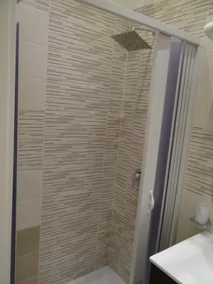 a shower with a glass door in a bathroom at Monte Palace Palermo in Palermo