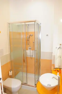 a bathroom with a shower and a toilet and a sink at Le Sette Meraviglie in Castellammare del Golfo