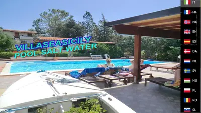 a group of people sitting in chairs by a swimming pool at VILLASEASICILY , POOL SALT WATER and NATURAL CHLORINE IN BALESTRATE - PALERMO in Balestrate