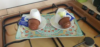 two hot dogs on a plate on a stove at Loft in Balestrate vicino al Mare - Rental BeB in Balestrate