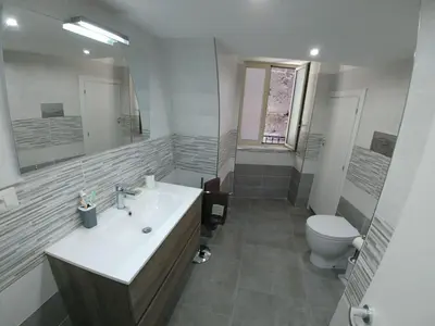a bathroom with a sink and a toilet at Cassaro Antico in Palermo