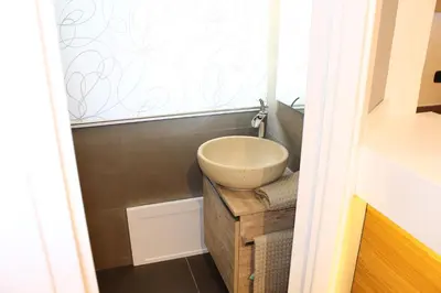 a small bathroom with a sink and a mirror at Casa Siciliabedda in Capaci