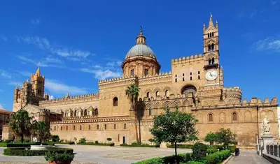 a large building with a clock tower on top of it at Casa Siciliabedda in Capaci