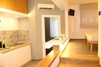 a kitchen with a sink and a bed in a room at Casa Siciliabedda in Capaci
