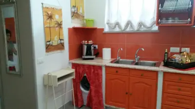 a kitchen with a sink and a counter top at Casa Marta in Palermo