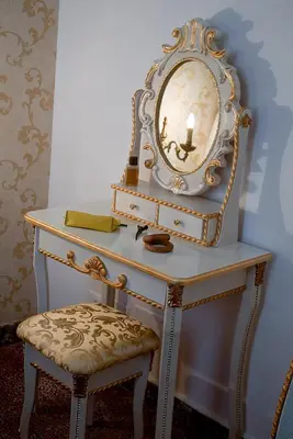 a dressing table with a mirror and a chair at Palermo Gallery in Palermo