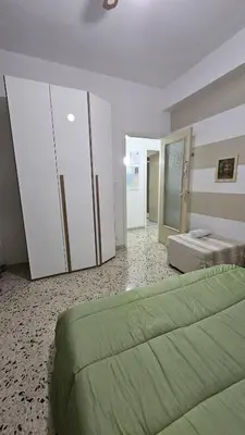 a large bedroom with two beds and a closet at Le Terrazze in Carini